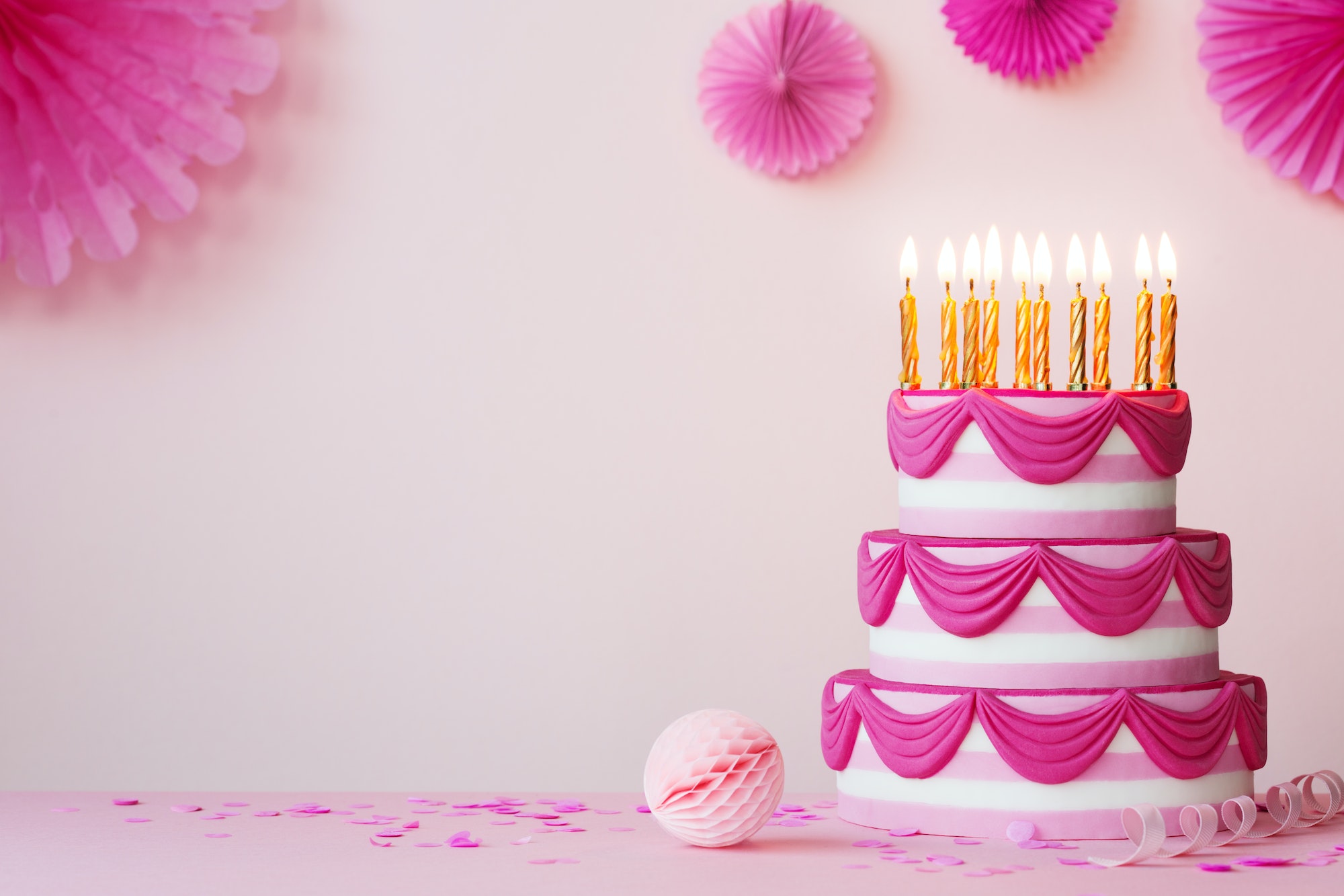 Birthday party with pink tiered cake